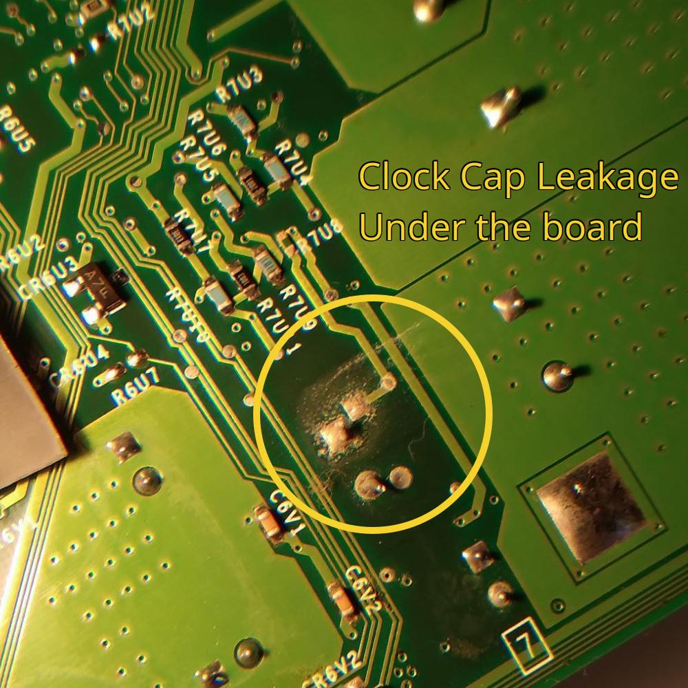 (clock cap leakage on underside of board)