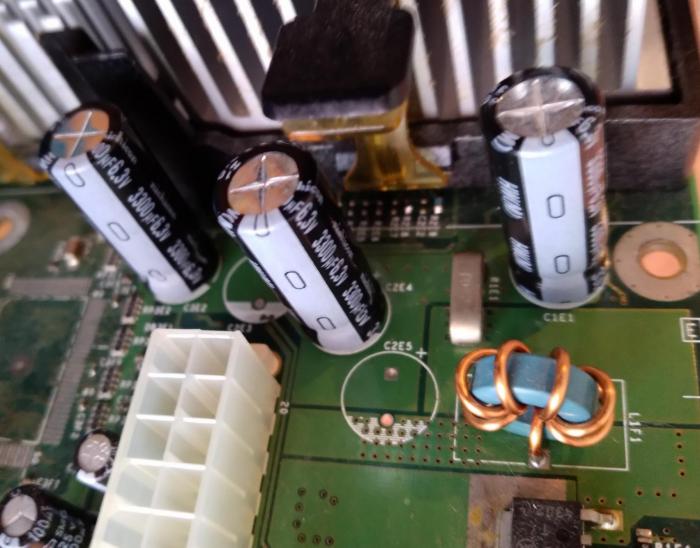 (closeup of new caps in place on the board)